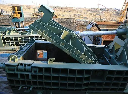 Industrial hydraulic scrap baling press used in rubber recycling, metal scrap compaction, and waste management — durable machinery from leading manufacturer in India.