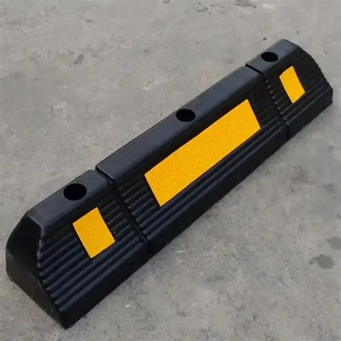 Heavy-duty rubber wheel stopper for precise vehicle parking and protection from impact. Resistant to oil, heat, and weather. (Keywords: rubber wheel stopper, parking safety product, parking block)