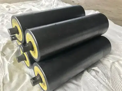 Heavy-duty industrial rubber rollers for conveyor systems, designed for wear resistance and smooth material handling in mining and processing plants. Keywords: rubber rollers, conveyor rollers, heavy-duty rubber components, industrial rollers.