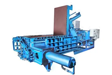 Industrial hydraulic scrap baling press used in rubber recycling, metal scrap compaction, and waste management — durable machinery from leading manufacturer in India.